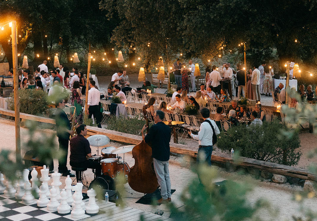 Dilia Jazz Band quartet playing at an evening wedding reception under string lights in Provence